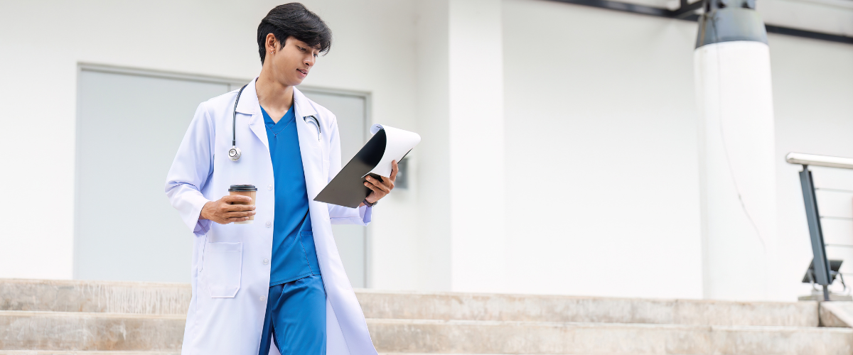 Confident Doctor walking down stairs