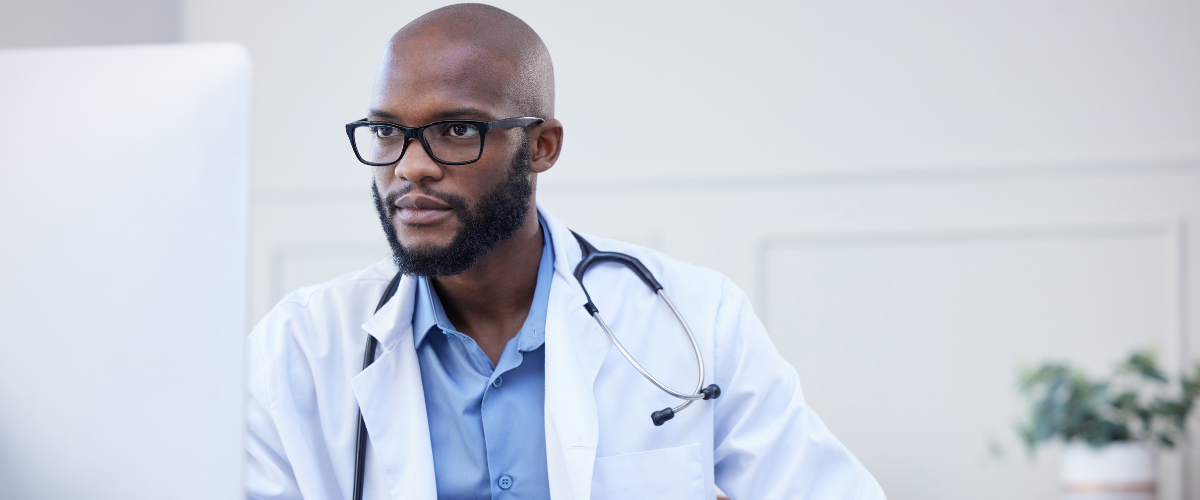 Doctor looking concerningly at a computer