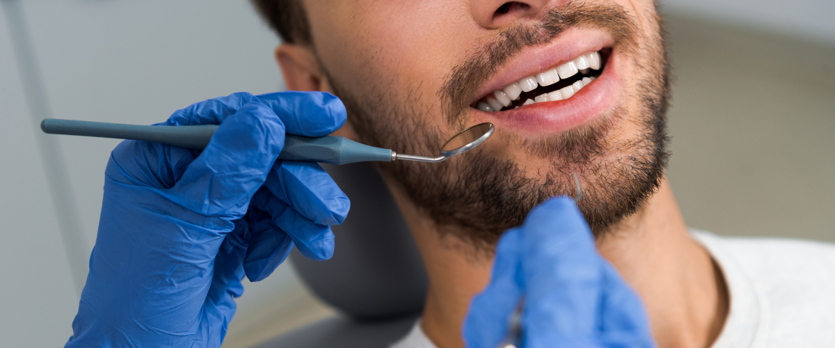 Closeup of man getting a dental cleaning