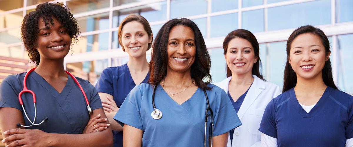 Group of female physicians outside of a hospital
