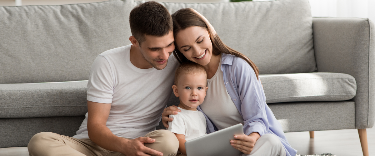 Smiling Family With Baby